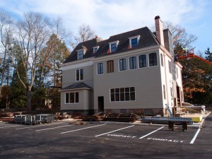 Work is nearly finished on the ‘pink house,’ which now sports a gray paint scheme.